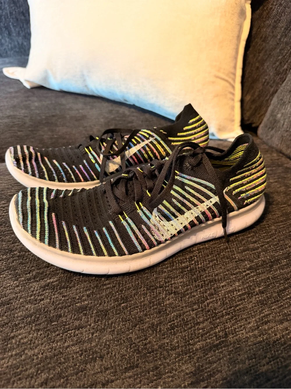 Nike Black Flyknit Sneakers with Multicolor Stripe Accents